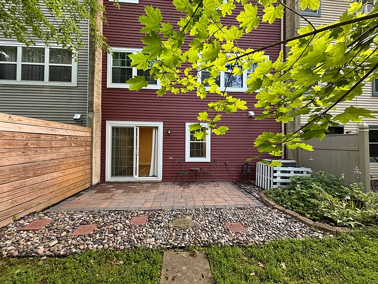 brick patio with small garden facing the creek, shady