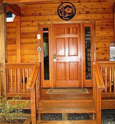 As you enter the home. This view shows the outstanding woodwork. To your left is the home's deck.