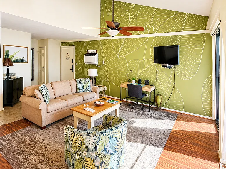 Open floor plan in living room with dedicated work space and high speed internet, included.