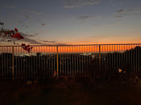 Watch the sunset go down over the city every night