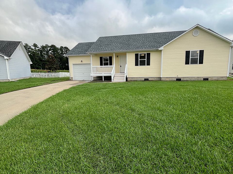 Front view of house with lush grass