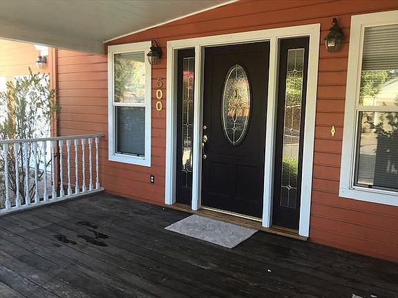 Large front porch accessed from front door and french doors off kitchen. Great extended living space-perfect for entertaining