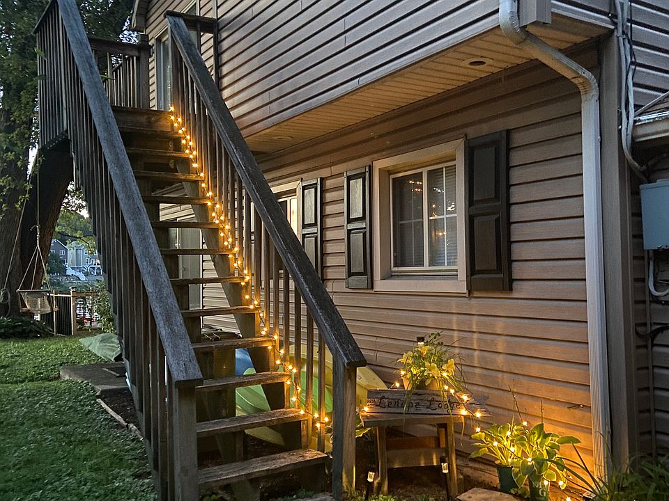 Outside stairs leading up to Lenape Lodge lit up at night