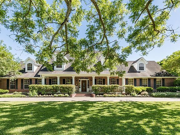 Home is situation on a 2.6 acre lot with many mature trees which provide wonderful shaded areas.