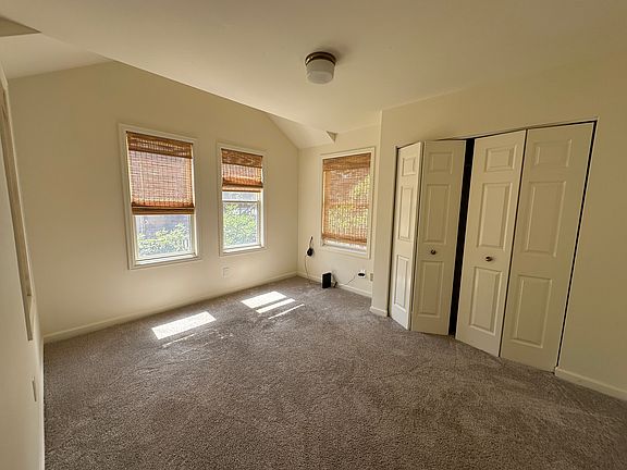 Bedroom 1 facing south. You can see front yard and greek across the street.