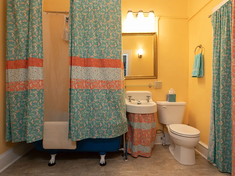 Bathroom with clawfoot tub, shower, and standard basics.