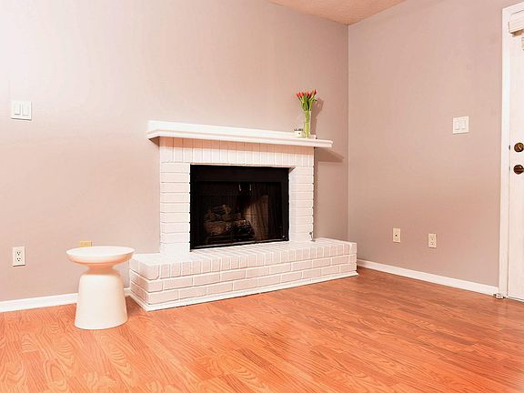 Living room with gas fireplace. We can put TV mount in above fireplace for renter.