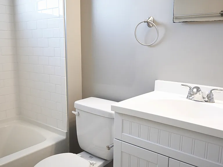 White vanity and mirror in a unit at Slips at Blackstone.