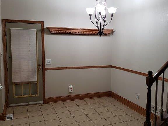 Eating area next to kitchen and door to covered patio