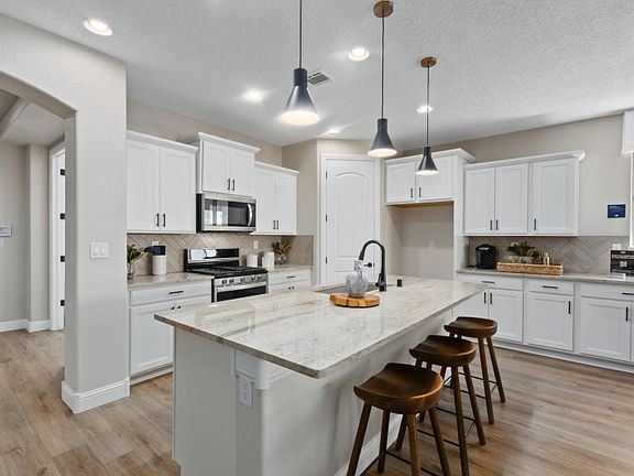 Enjoy breakfast each morning at your built-in, island bar.