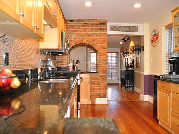 Kitchen with Granite and Exposed Brick