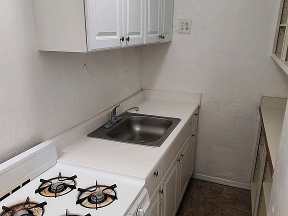 Kitchen includes refrigerator and stove