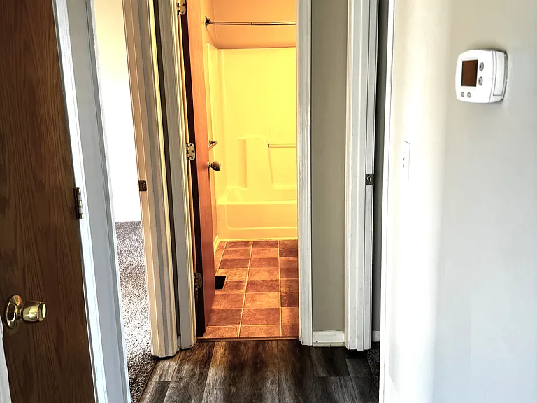 HALLWAY TO BEDROOMS AND BATHROOM