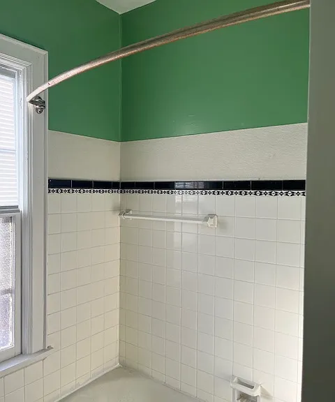 Tiled shower cast iron Tub