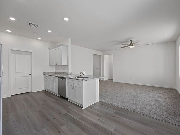 The family room is spacious and open to the kitchen and dining room.