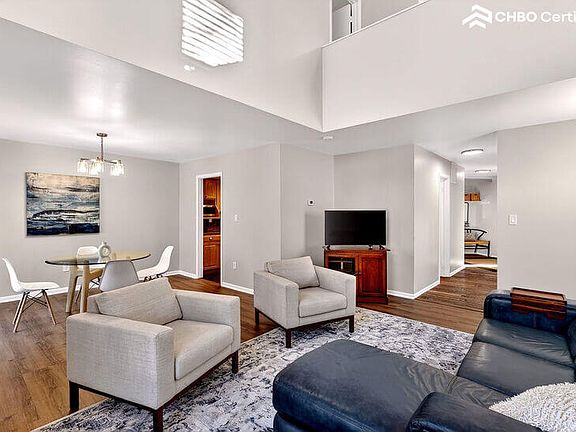 Living Room with View to Entry + Smart TV