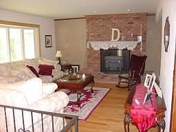 Living room with fireplace and big new picture window