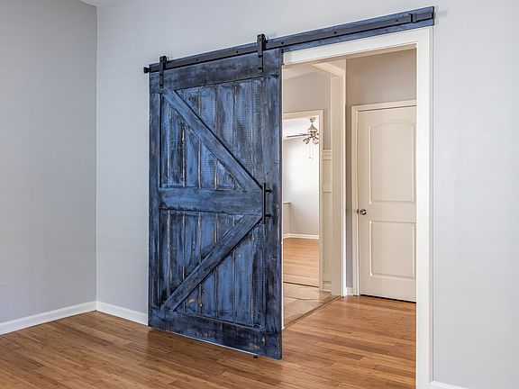 Accent barn door can be used to close off the living room space or leave it open
