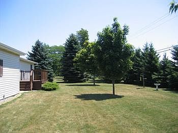 The back yard, quite and secluded. Notice the 10 X 14 Deck.