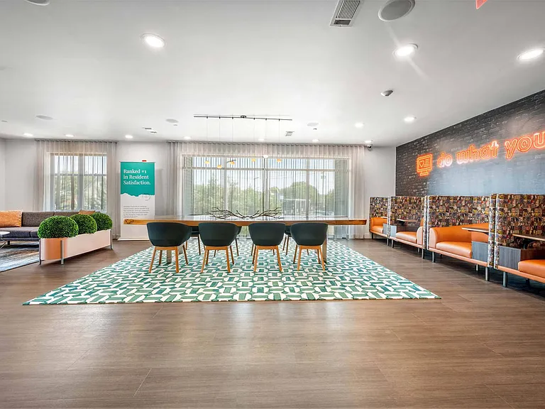Make the most of the club suite with dining tables and booths that are ideal for eating, gathering, or getting work done.