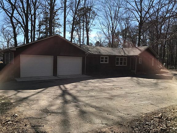 Rear view of the house, large enclosed two car garage.