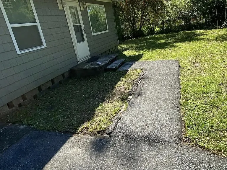 front asphalt walkway and driveway