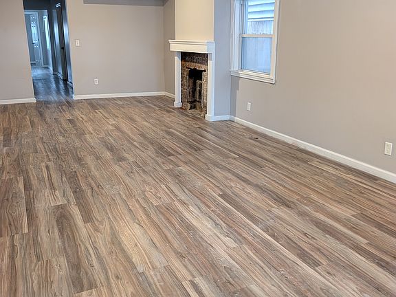 freshly painted and new flooring in living room