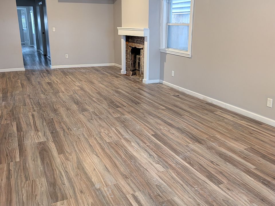 freshly painted and new flooring in living room