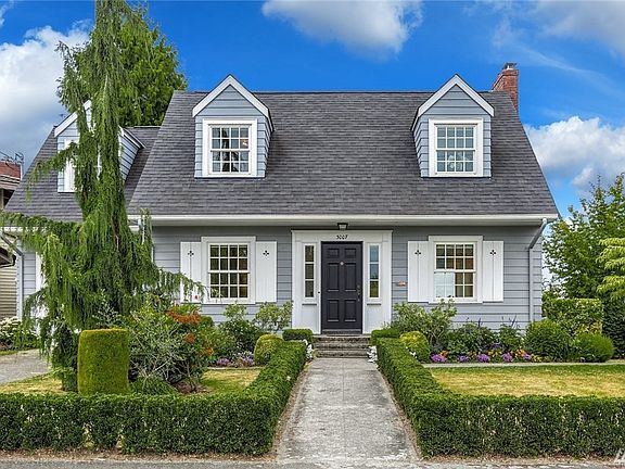 Lovely landscaping adorns this charming 1937 four bedroom, two full and one half bath home with updates and views.