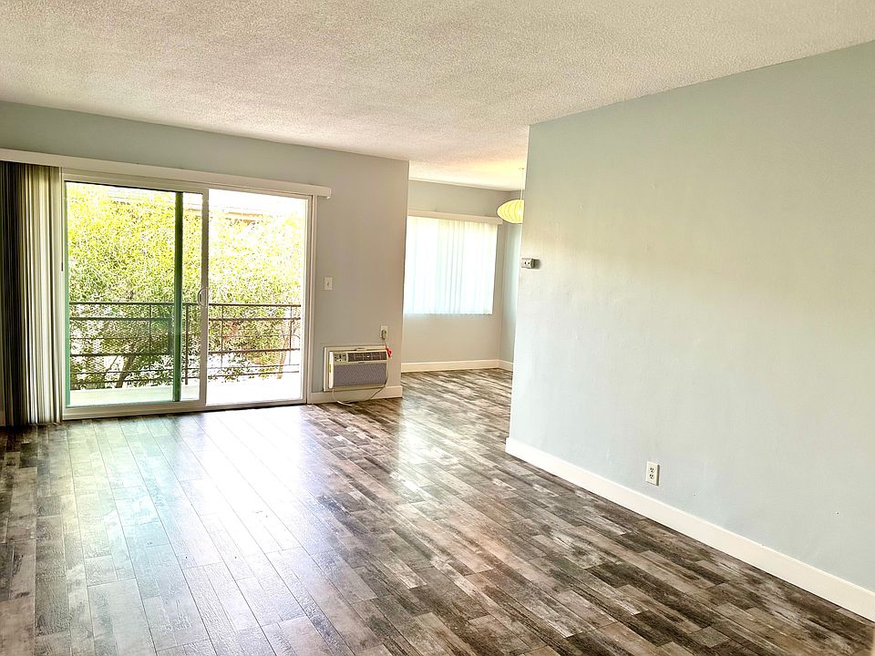 Large Living Space with Balcony and Dining Room
