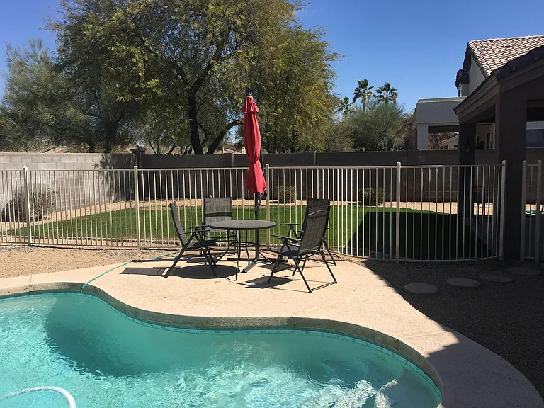 Pool with patio furniture (included) and grass yard for dogs and kids.