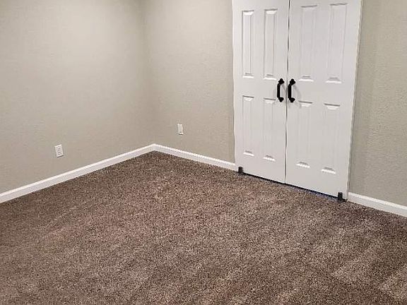 Master bedroom with sliding barn doors to master closet and master bath