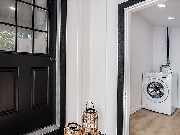 Utility closet off of front porch with new washer