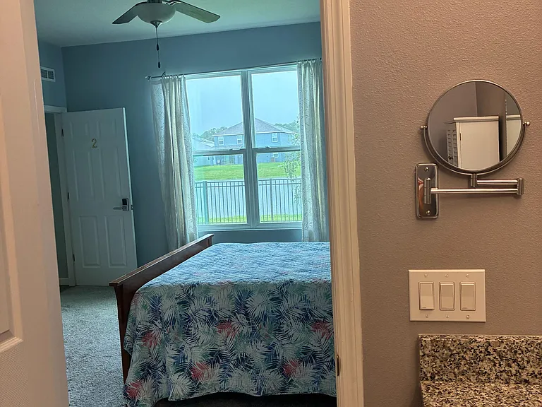 Room2: Bed and backyard view