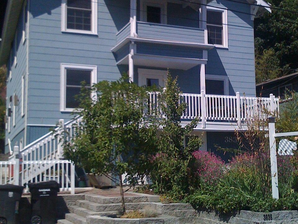 The front yard is grown up now; with shared patio and mature trees.