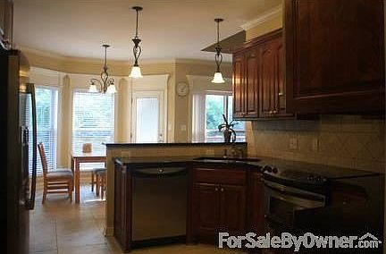 Kitchen
						:
						Granite countertops with stainless steel appliance and maple cabinet.