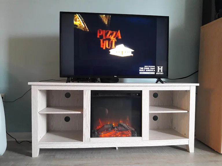 Entertainment center with fireplace and heat blower can be turned on display or without when toggled to heat or off on chilly nights.
