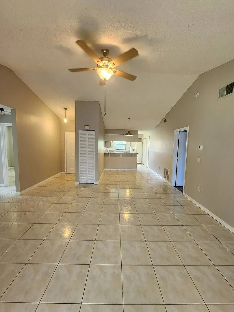 Move-In Ready Poinciana Gem with a Brand-New Kitchen & Screened Porch! — Photo 4