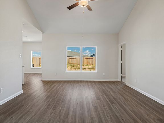 Family room with a window overlooking the backyard