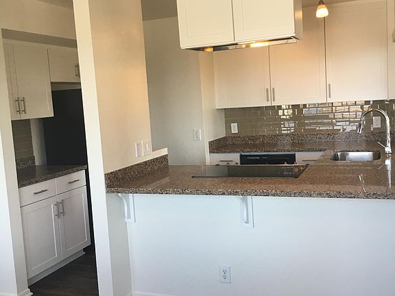 Granite countertops, tile backsplash, stainless steel applia