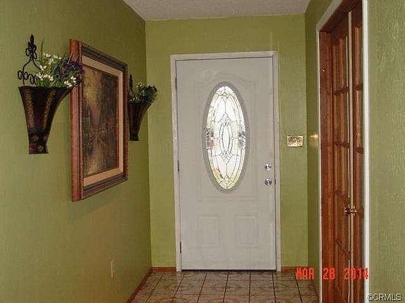 Entry way leading in to home showing french doors to office/den