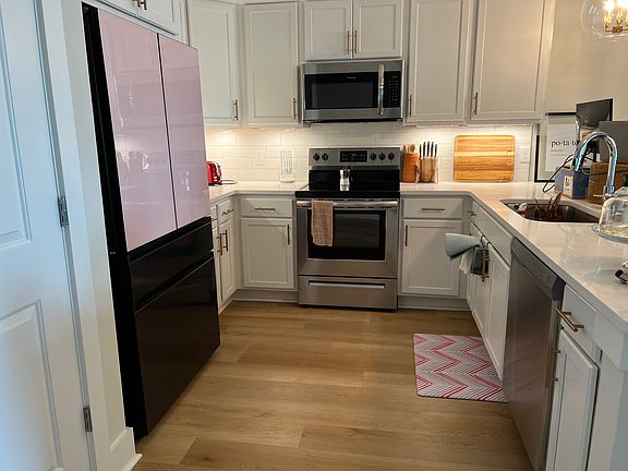 Shared upstairs kitchen, stainless steel kitchen appliances - oven, stove, refrigerator, dishwasher, microwave, toaster, coffee maker, etc.