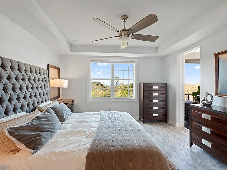 Master bedroom with beautiful view of water