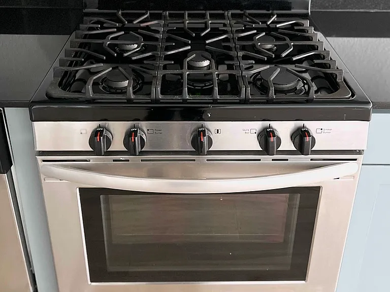 New stainless steel oven and gas burners.