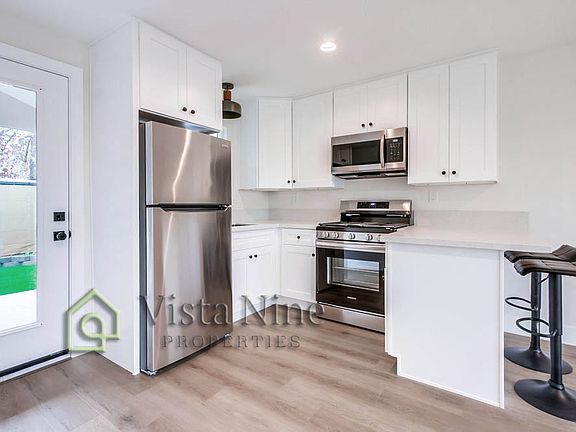 Stainless steel appliances, door to private yard