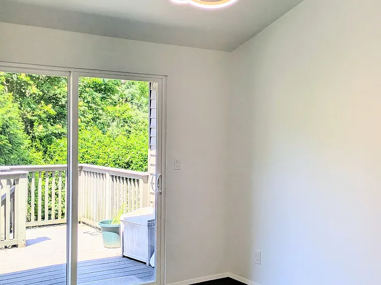 Dining area with walkout to deck, all new sliding doors and lighting