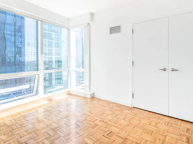 Bedroom with Floor-to-ceiling Windows and Hard Surface Flooring