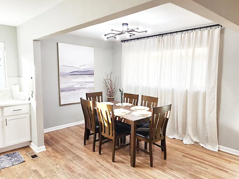 Dining and workspace area in furnished mid-term rental near hospitals and business centers