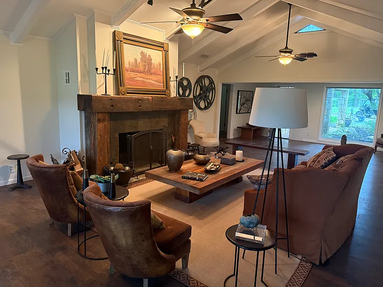 Living room with large wood burning fireplace