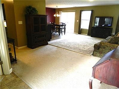 Foyer opens up to large living room, which exits to deck.